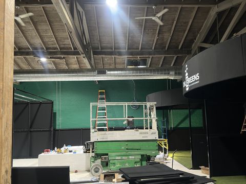 Bay toppers and a lift under the barn roof during the build